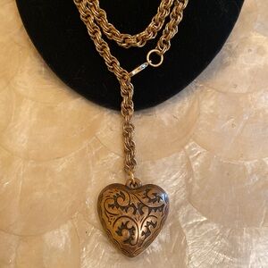 Vintage etched puffy heart pendant on vintage chain.